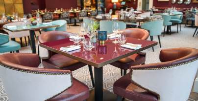 Tables in a luxurious restaurant with red walls