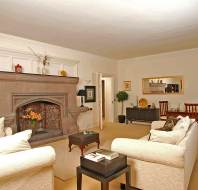 Comfortable armchairs and stone fireplace