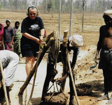 Senior woman helping with work on a well